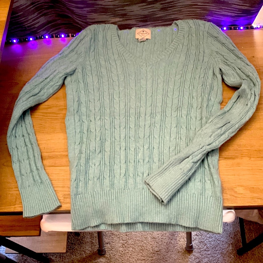 Cute turquoise sweater. Never worn.